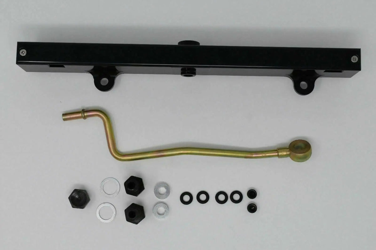Jack Spania Racing K-Series billet aluminum high flow fuel rail for K20 and K24 engines, with detailed mounting features.