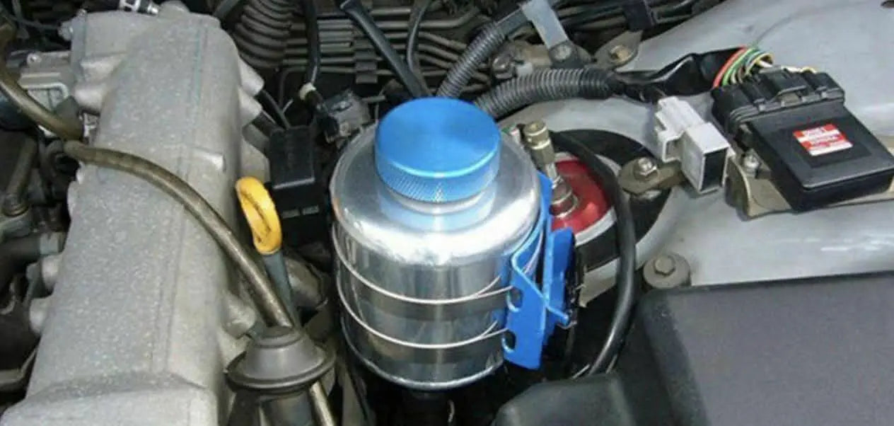 Jack Spania Racing billet aluminum power steering tank reservoir with cap, universal suspension part for automotive performance.