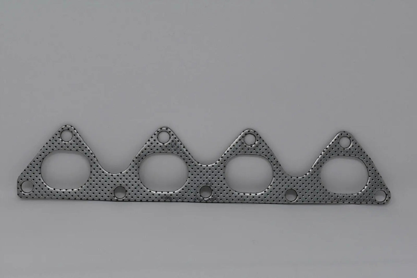 Graphite B-Series header exhaust manifold gasket for Honda B18C5 Type R and B16A3 engines, OEM spec from Jack Spania Racing.