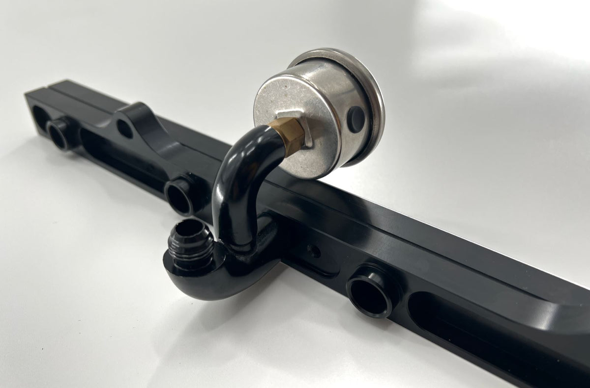 Jack Spania Racing center mount fuel gauge with AN6 fitting for K Tuned K Series fuel rail on K20 and K24 engines.