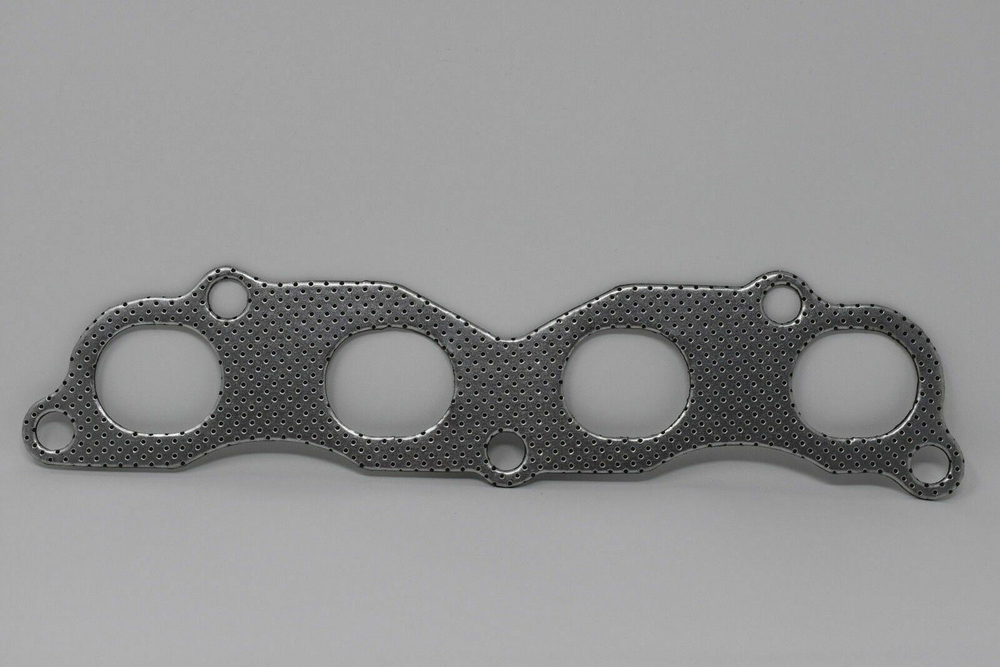 Jack Spania Racing graphite exhaust manifold gasket for Acura Honda K20 K24 K series engine, suitable for EP3 Type S, TL, TSX models.
