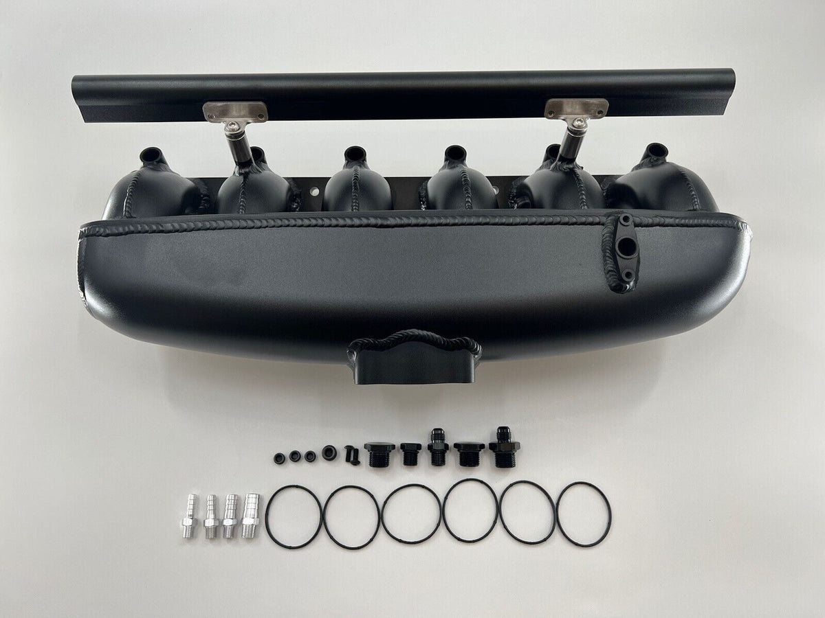 Center feed intake manifold fuel rail for BMW N54 135i, 335i, 535i engine parts by Jack Spania Racing, shown in image.