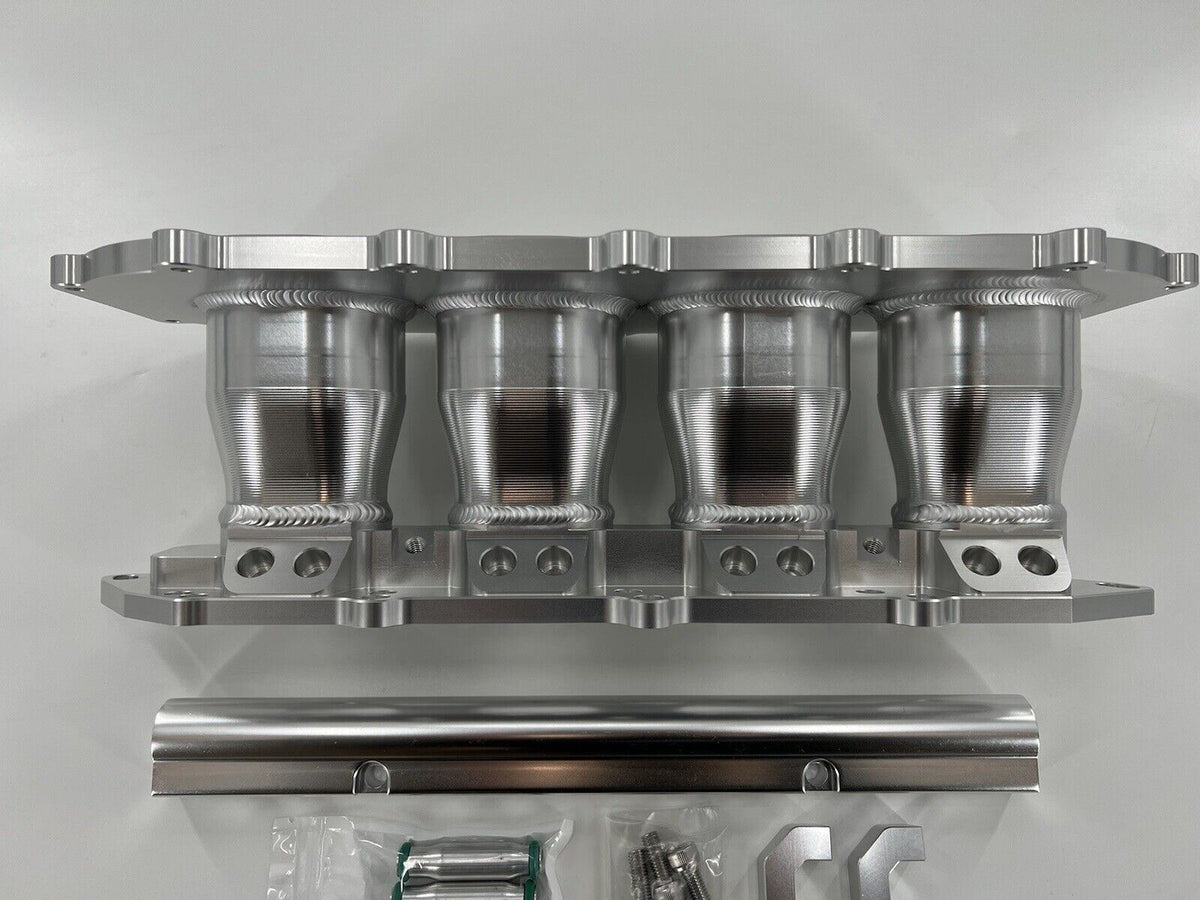 Jack Spania Racing billet B Series intake manifold adapter kit for Skunk2 Ultra Plenum engine parts shown in image.