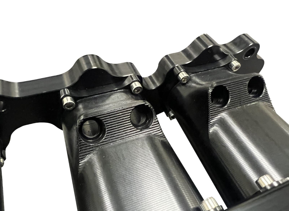 Jack Spania Racing 2JZ GTE intake manifold with 12 injector fuel rail and throttle body, engine parts for performance upgrades.