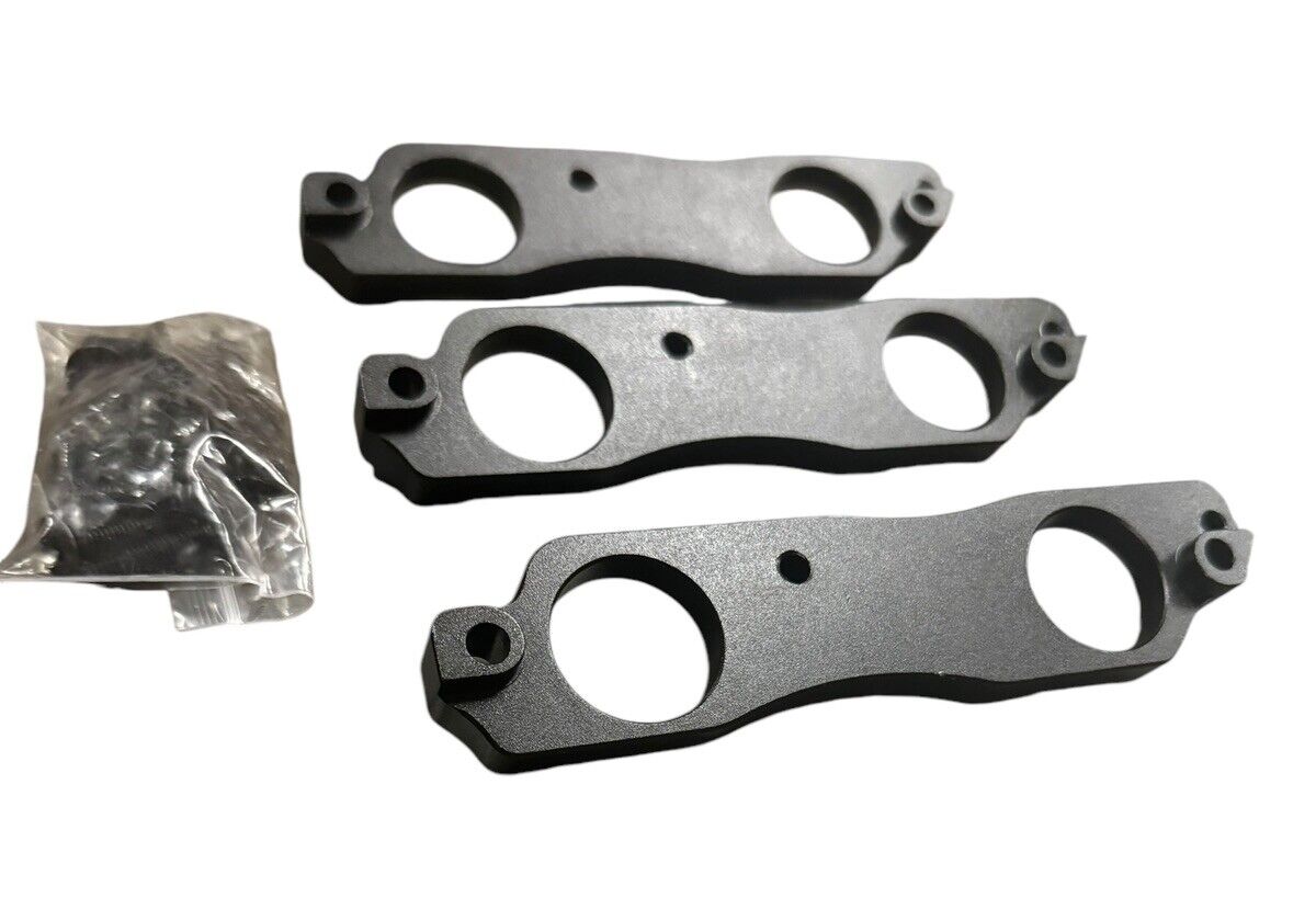 Black aluminum coil pack brackets for R35 GTR, compatible with Toyota 1JZ and 2JZ engines, by JackSpania Racing.