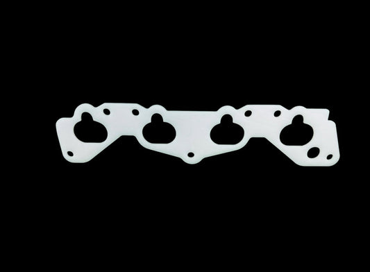 JackSpania Racing thermal intake manifold gasket for Honda Civic D15 D16 D Series engine, visible with black rubber and metal components.