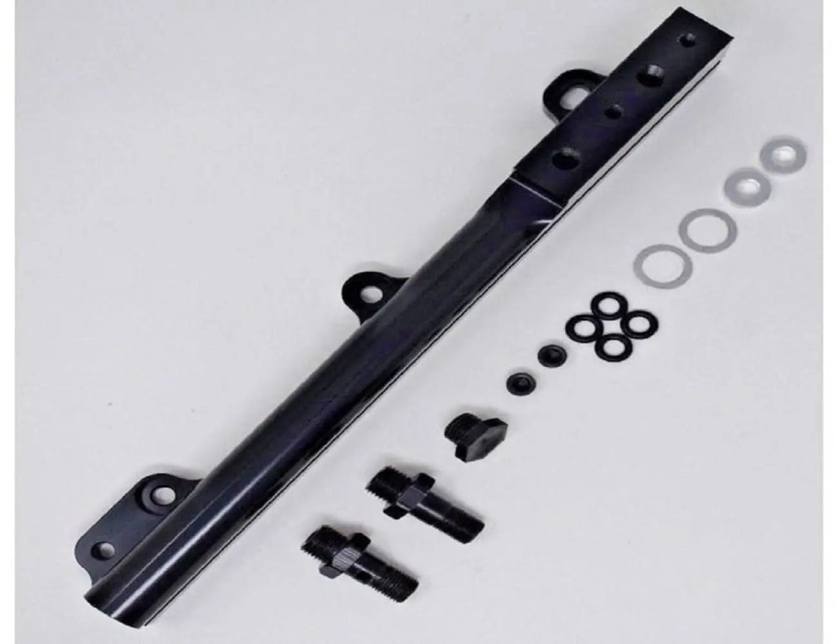 Jack Spania Racing D Series fuel rail for Honda Civic Si, Integra, and CRX non-VTEC engine parts, shown mounted on engine.