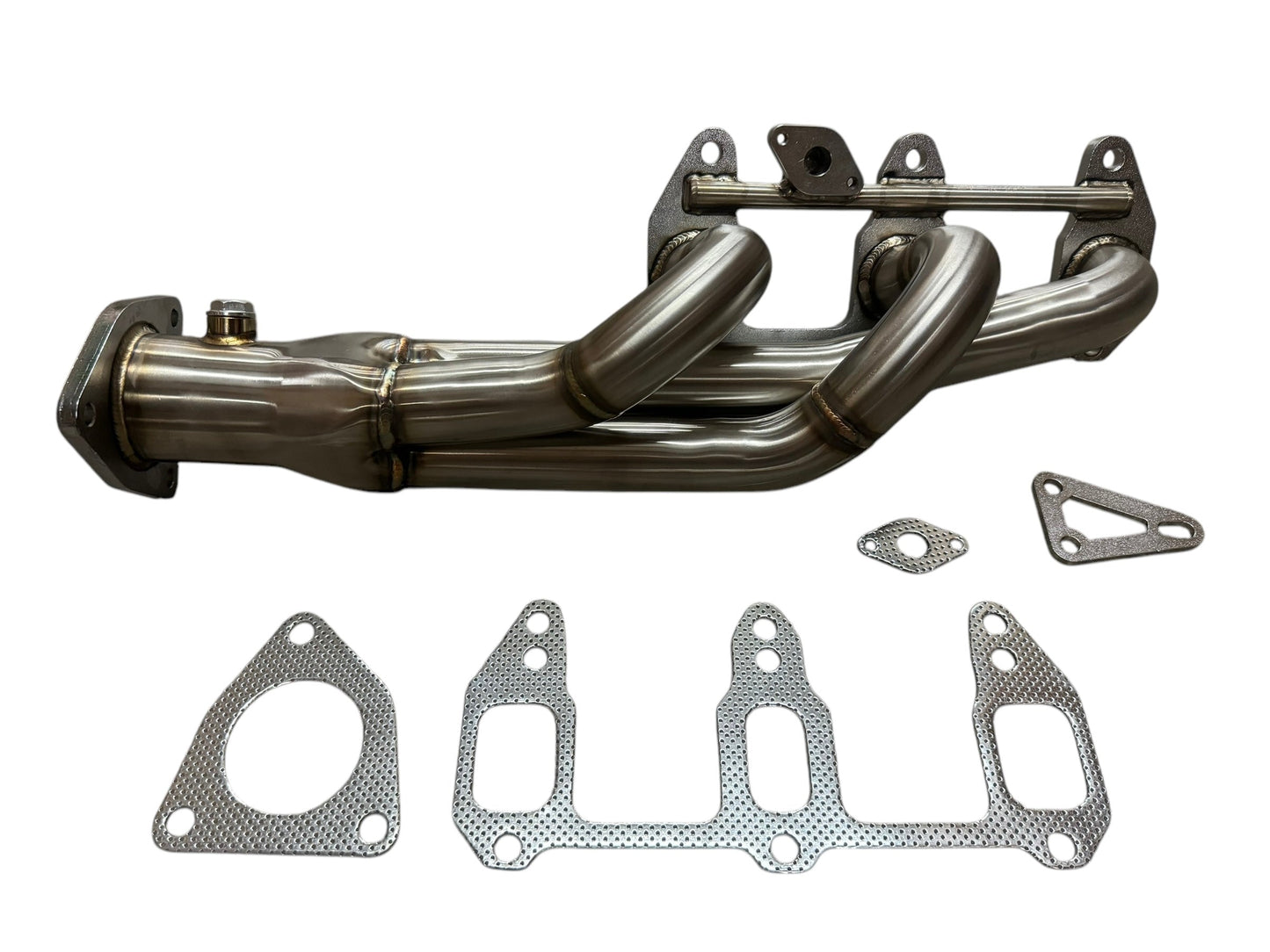 JackSpania Racing 3-1 shorty exhaust manifold for Mazda RX-8 1.3L rotary engine, showing the polished header with flange attachment.