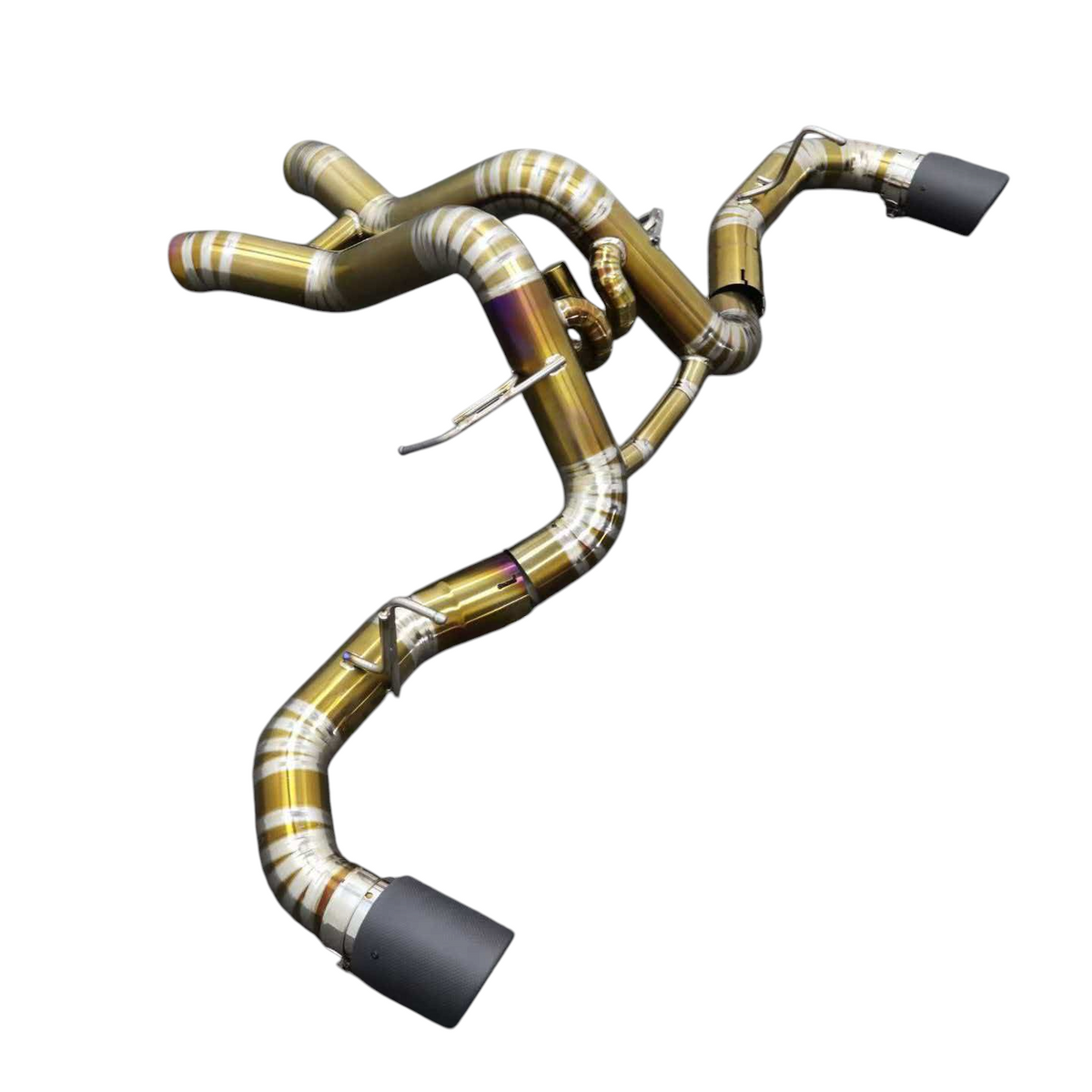 JackSpania Racing titanium exhaust system for McLaren 570S, 620R, and 540C F1 race cars, showing polished exhaust pipes and fittings.