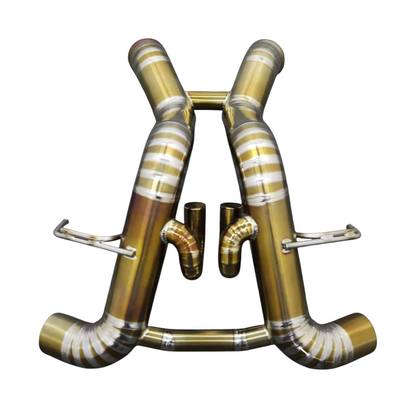 JackSpania Racing titanium exhaust system for McLaren 570S, 620R, and 540C F1 race cars, showing polished exhaust pipes and components.