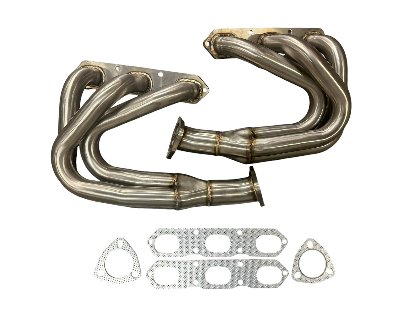 JackSpania Racing exhaust headers for Porsche 911 Carrera S 996 and 997.1 models, showing polished metal construction and inlet ports.