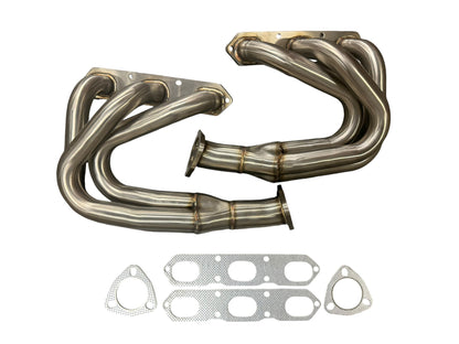 JackSpania Racing exhaust headers for Porsche 911 Carrera S 996 and 997.1 models, showing polished metal construction and inlet ports.