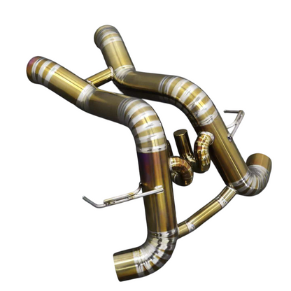 JackSpania Racing titanium exhaust system for McLaren 570S, 620R, and 540C F1 race cars, showcasing polished metal pipes and fittings.