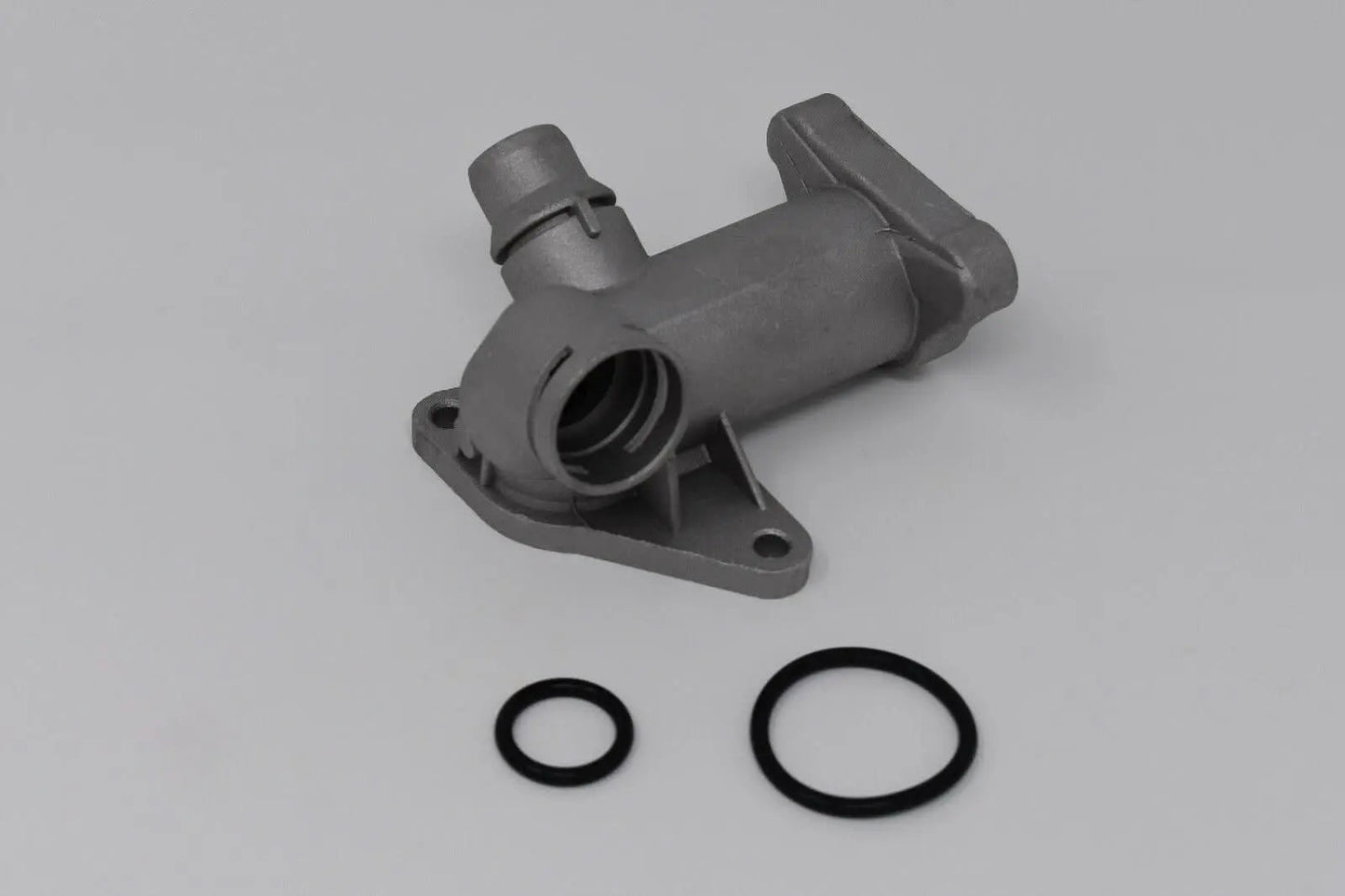 Cast aluminum coolant flange with temperature sensor for Audi B5 A4 1.8T engine, by Jack Spania Racing, showing the component's details.