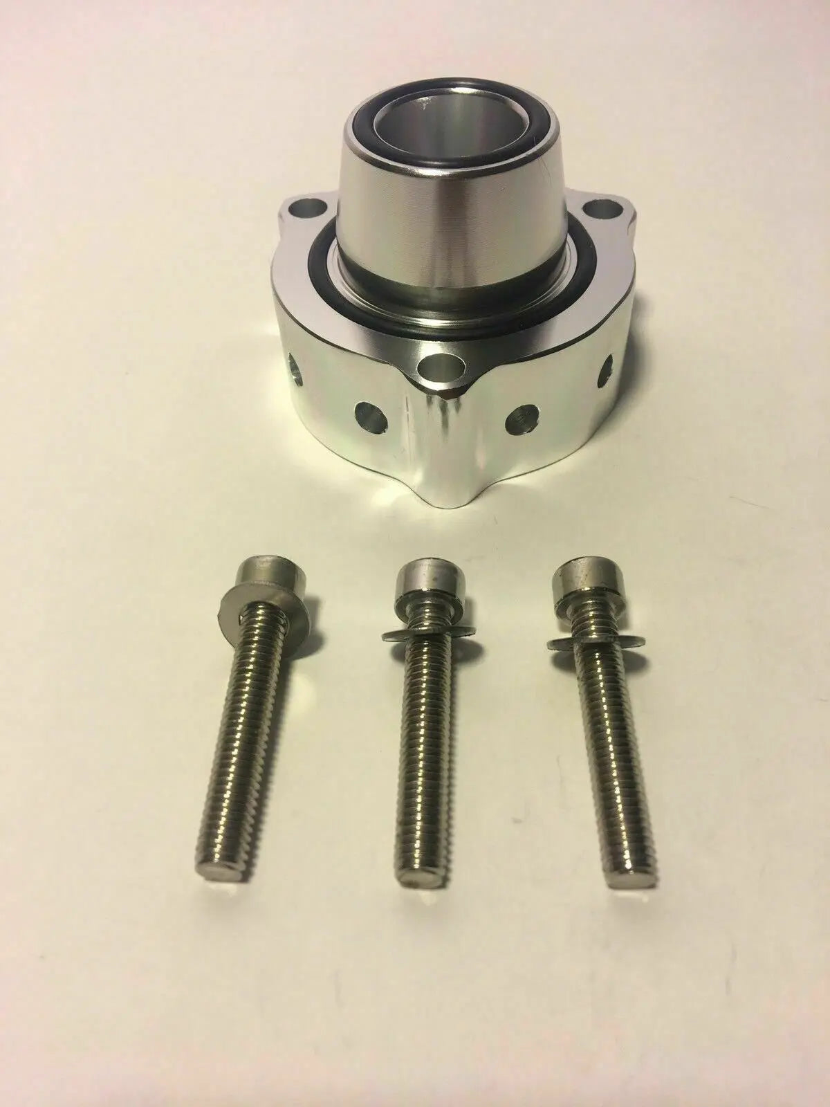 Jack Spania Racing VW Audi blow off valve spacer for TSI FSI TFSI engines, shown installed on a 2.0T engine.