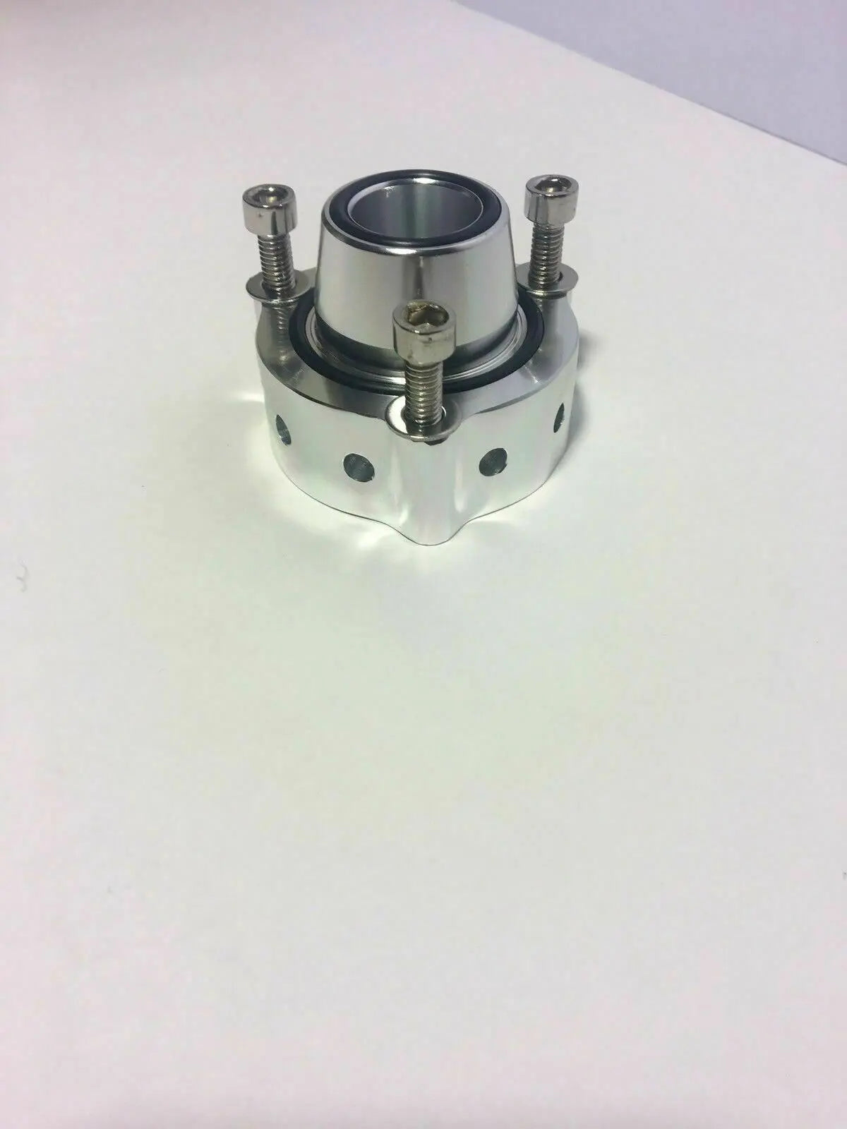 Jack Spania Racing VW Audi blow off valve spacer for TSI FSI TFSI engines, showing the metal diverter component.