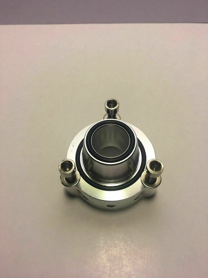 Jack Spania Racing VW Audi blow-off valve spacer for TSI, FSI, TFSI engines, mounted on engine with metal construction and branding.