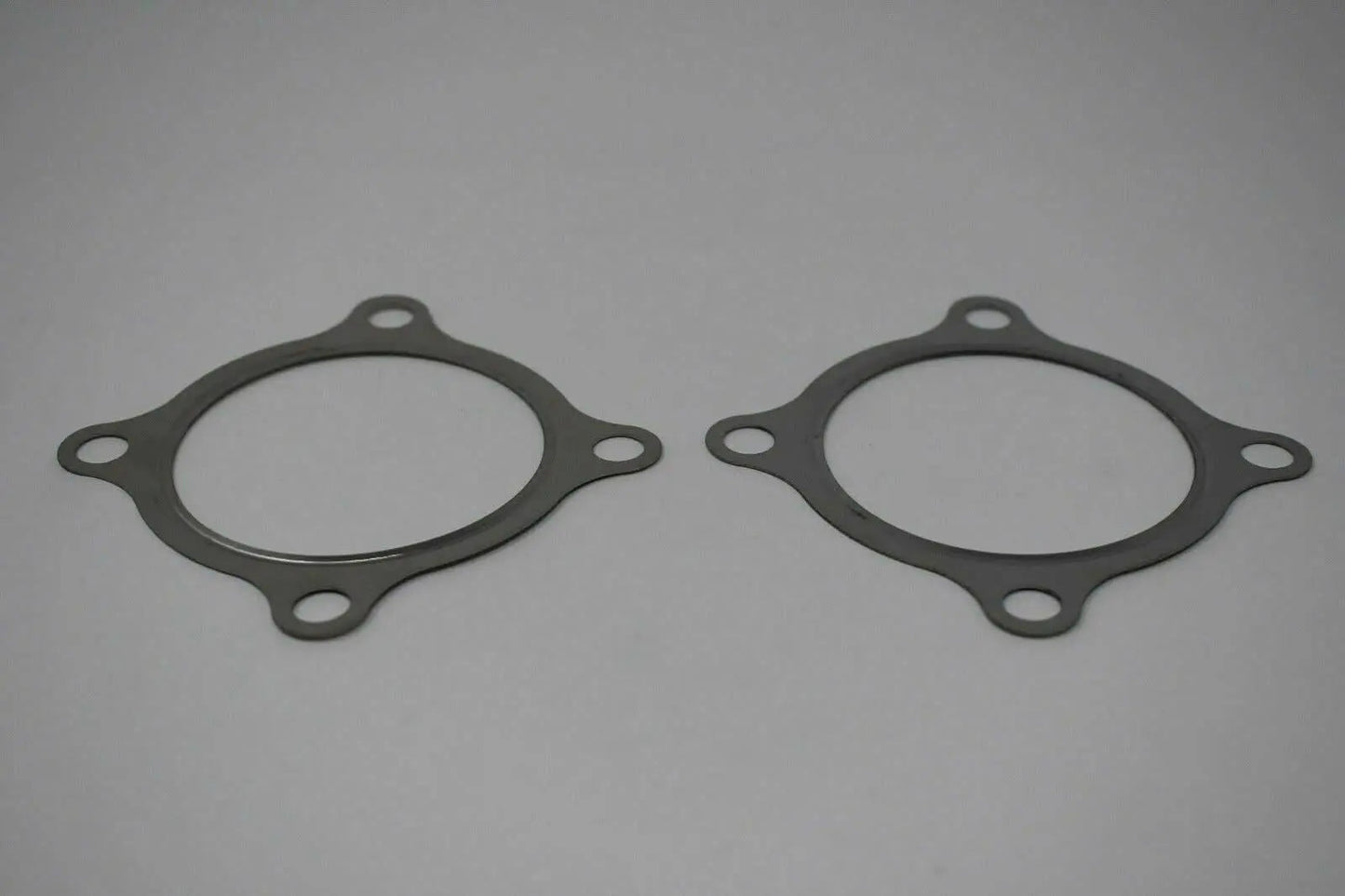 Stainless steel 2x 3-inch 4-bolt turbo downpipe gasket for GT30 GT35 T3 turbochargers, compatible with Jack Spania Racing engine parts