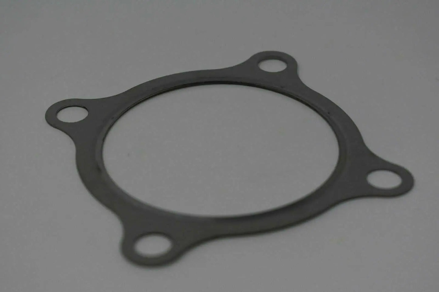Stainless steel 3-inch turbo downpipe gasket for GT30 GT35 T3 turbochargers, engine parts from Jack Spania Racing.