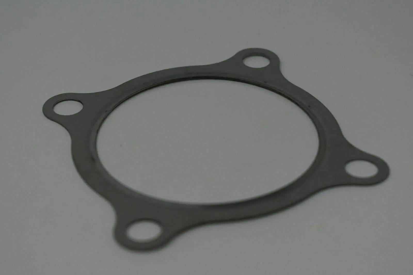 Stainless steel 3-inch turbo downpipe gasket for GT30 GT35 T3 turbochargers, engine parts from Jack Spania Racing.