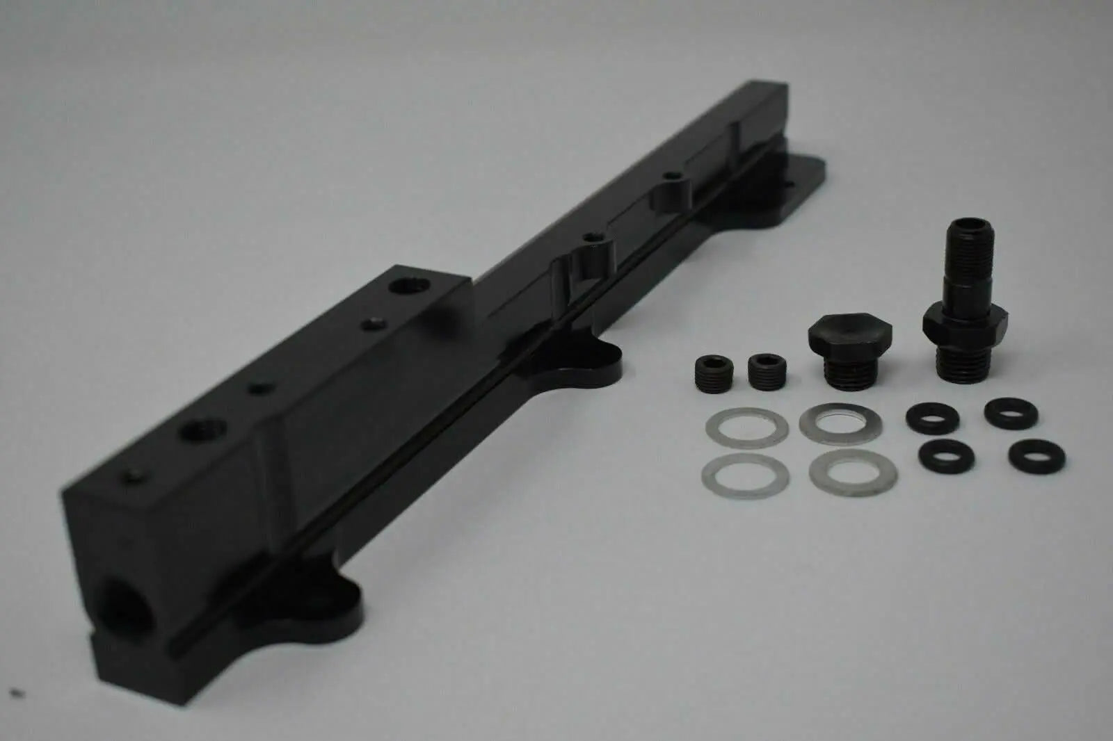 High-flow B Series fuel rail for Honda Acura engines, from Jack Spania Racing, featuring metal construction and inlet ports.