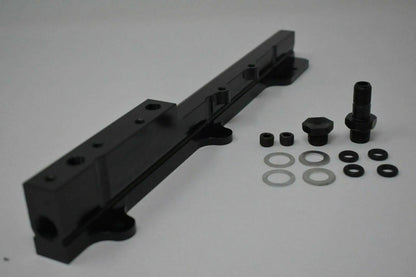 High-flow B Series fuel rail for Honda Acura engines, from Jack Spania Racing, featuring metal construction and inlet ports.