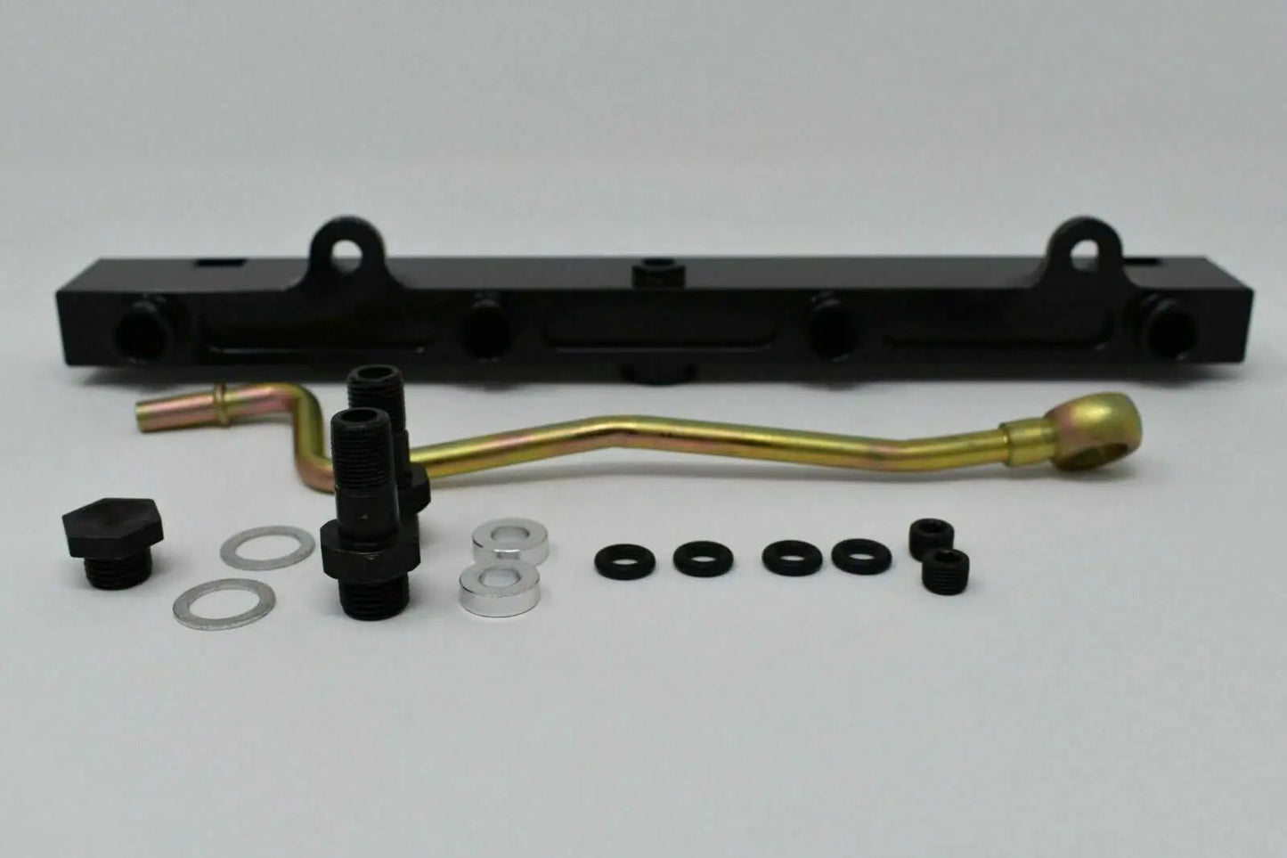 Jack Spania Racing K-Series billet aluminum high flow fuel rail for K20 and K24 engines, shown with mounting points and polished finish.