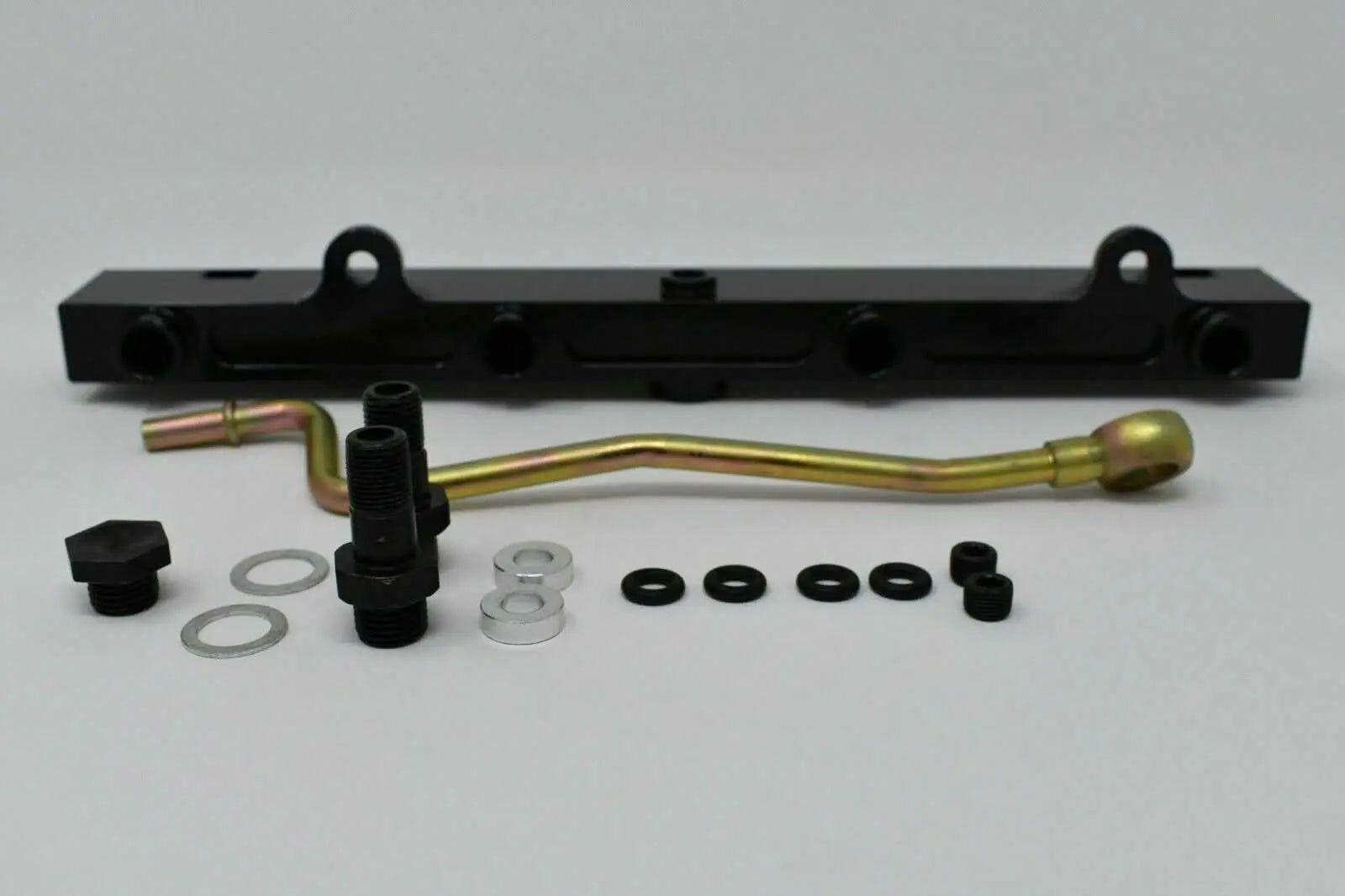 Jack Spania Racing K-Series billet aluminum high flow fuel rail for K20 and K24 engines, shown with mounting points and polished finish.