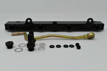 Jack Spania Racing K-Series billet aluminum high flow fuel rail for K20 and K24 engines, shown with mounting points and polished finish.