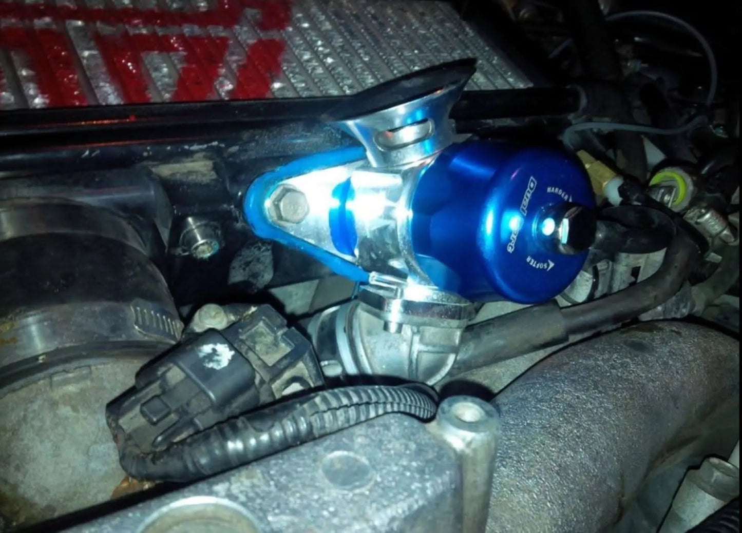 Dual port hybrid blow off valve for Subaru WRX and STI, by Jack Spania Racing, mounted on turbo engine components.
