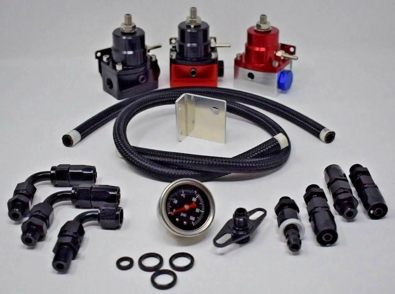 Adjustable EFI fuel pressure regulator kit with 160 PSI gauge, AN6 hose, and engine parts from Jack Spania Racing.