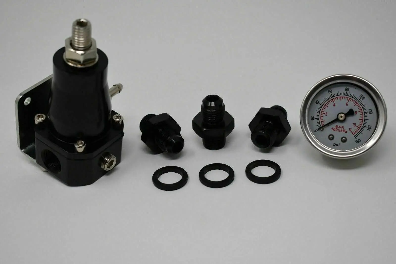 Jack Spania Racing adjustable EFI fuel pressure regulator with gauge, 30-70 PSI, AN6 bypass engine part for performance tuning.