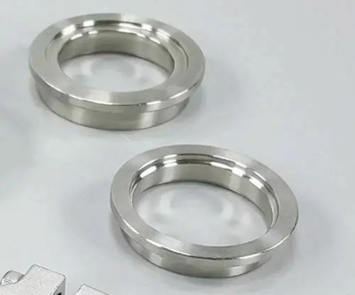 Jack Spania Racing 44mm wastegate flange set with V-band inlet and outlet, clamp ring, and insert for TiAL MVR turbochargers.