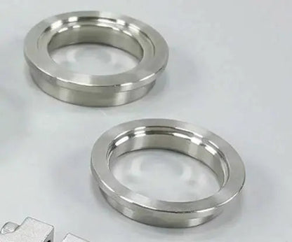 Jack Spania Racing 44mm wastegate flange set with V-band inlet and outlet, clamp ring, and insert for TiAL MVR turbochargers.
