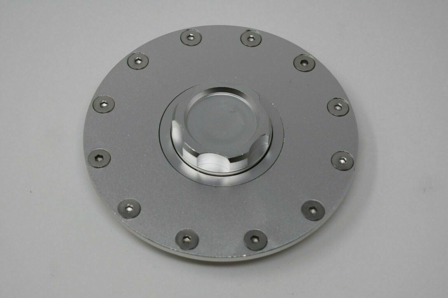 Jack Spania Racing replacement fuel cell gas tank filler cap, filler plate, and fittings for engine fuel systems.