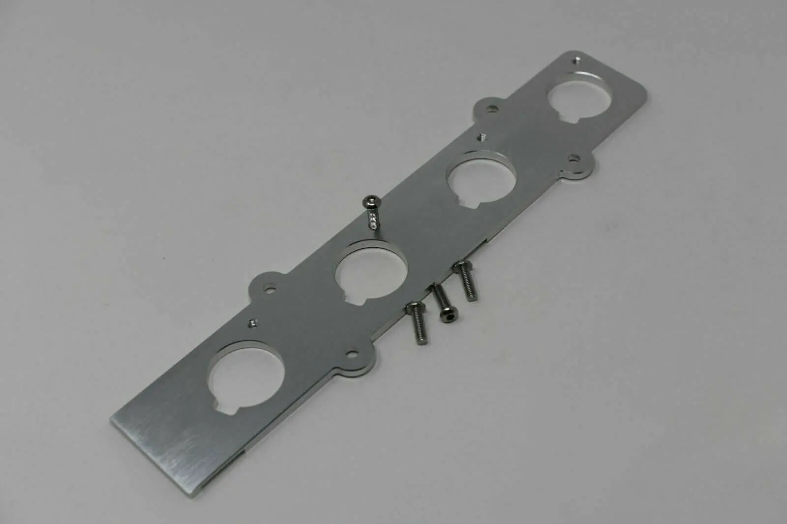 Jack Spania Racing B Series Coil On Plug (COP) Adapter Plate for Honda Acura B16 B18 engine conversion, showing the metal plate and mounting points.
