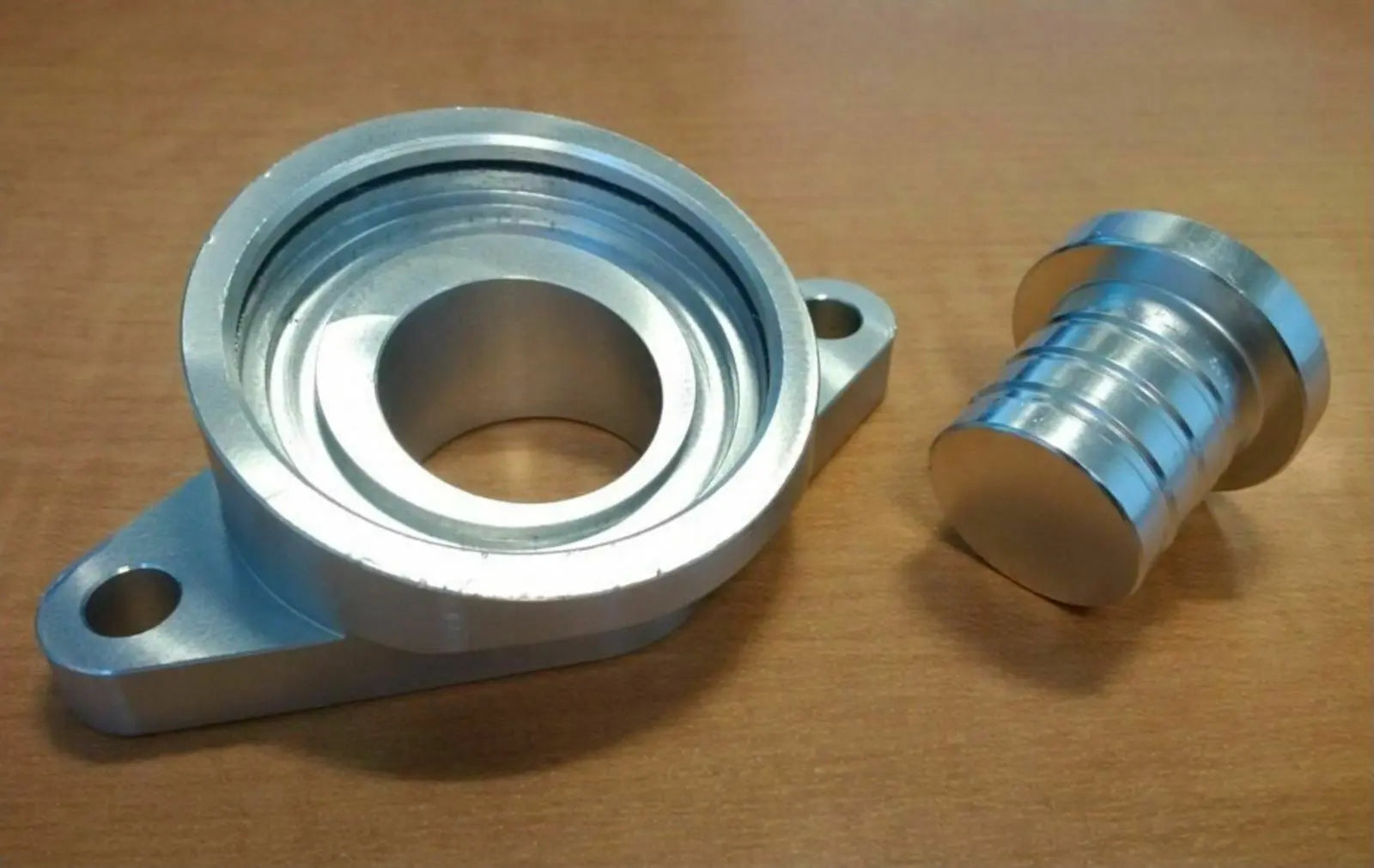 Jack Spania Racing SSQV BOV flange adapter plug for Skyline R32 R33 R34 RB20 RB25DET engine parts, shown on a white background.