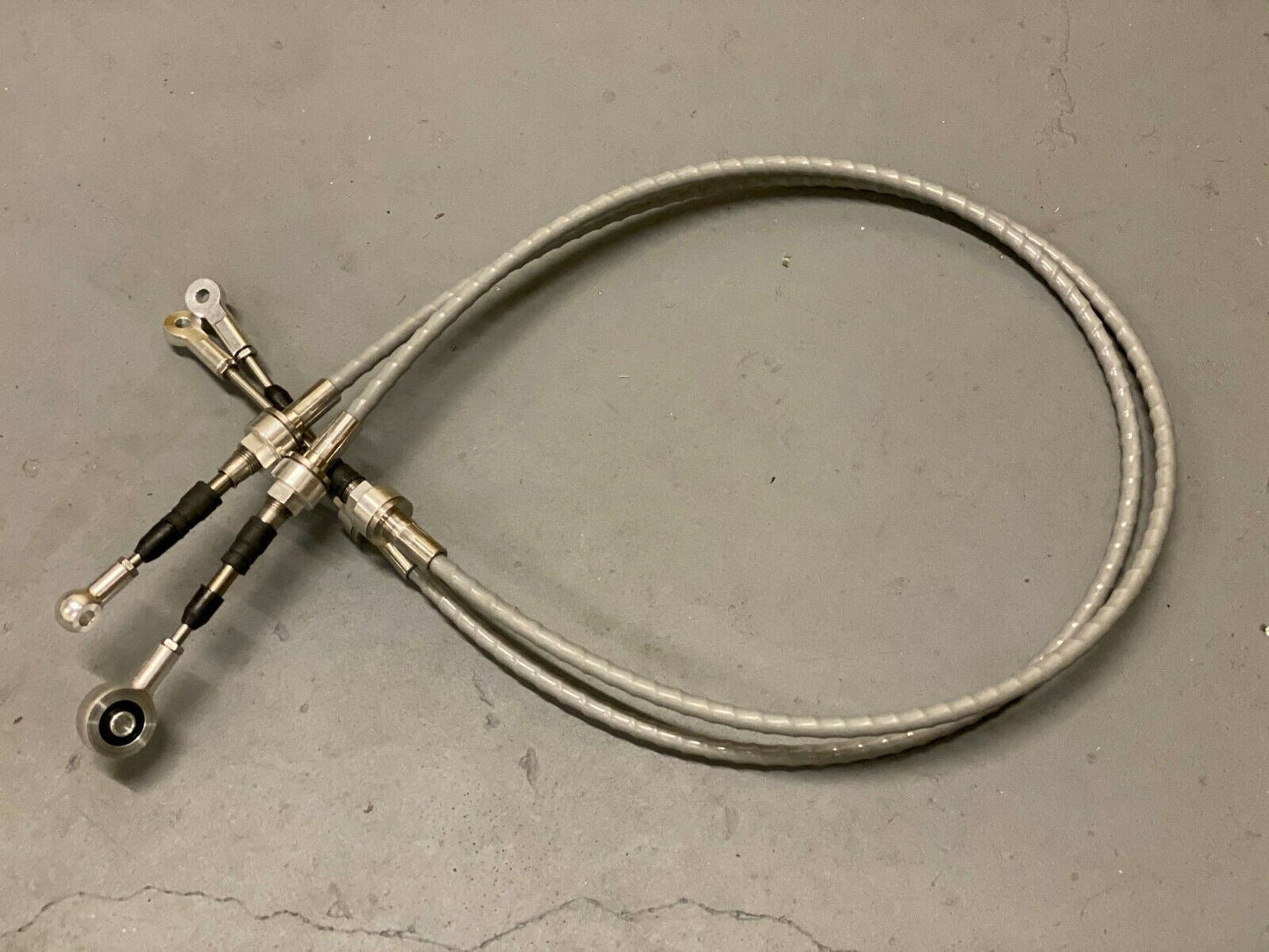 Jack Spania Racing RSX shifter cables and transmission bracket for K20 and K24 swaps, compatible with EG, EK, DC2 Honda models.
