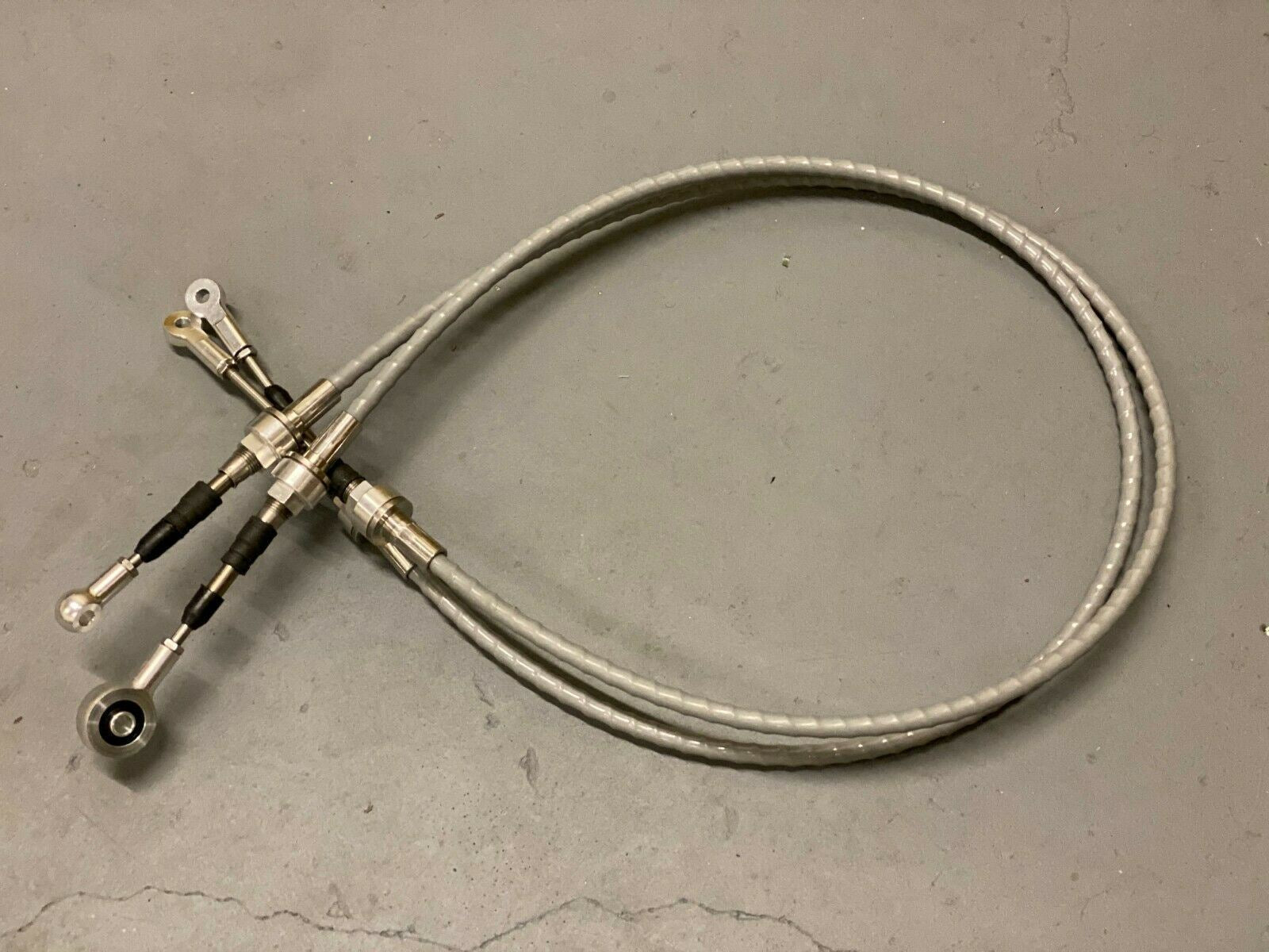 Jack Spania Racing RSX shifter cables and transmission bracket for K20 and K24 swaps, compatible with EG, EK, DC2 Honda models.