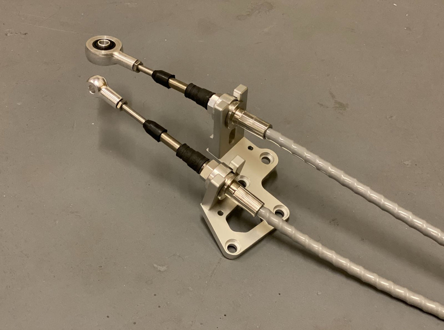 RSX shifter cables and transmission bracket from Jack Spania Racing for K20, K24, and K swap series on Honda EG, EK, DC2.