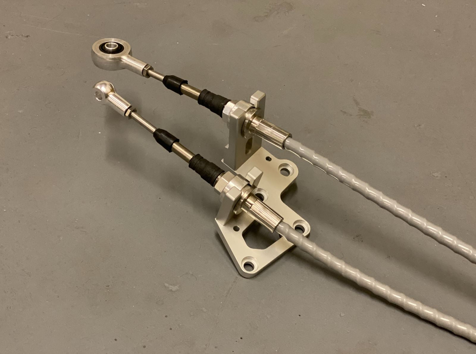 RSX shifter cables and transmission bracket from Jack Spania Racing for K20, K24, and K swap series on Honda EG, EK, DC2.