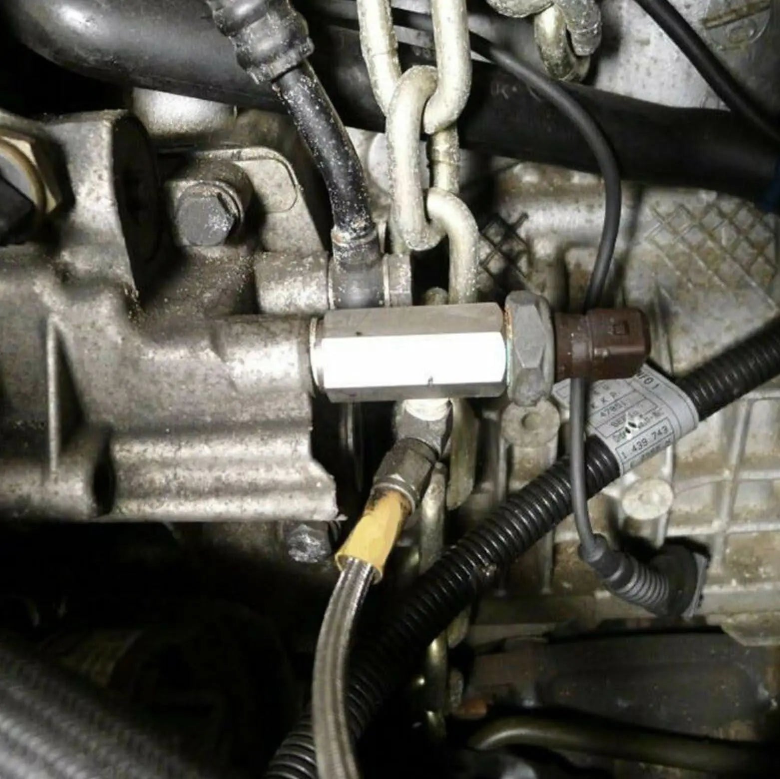 Jack Spania Racing oil pressure sensor tee with 1/8'' NPT adapter fitting for turbo supply line and engine gauge connection.