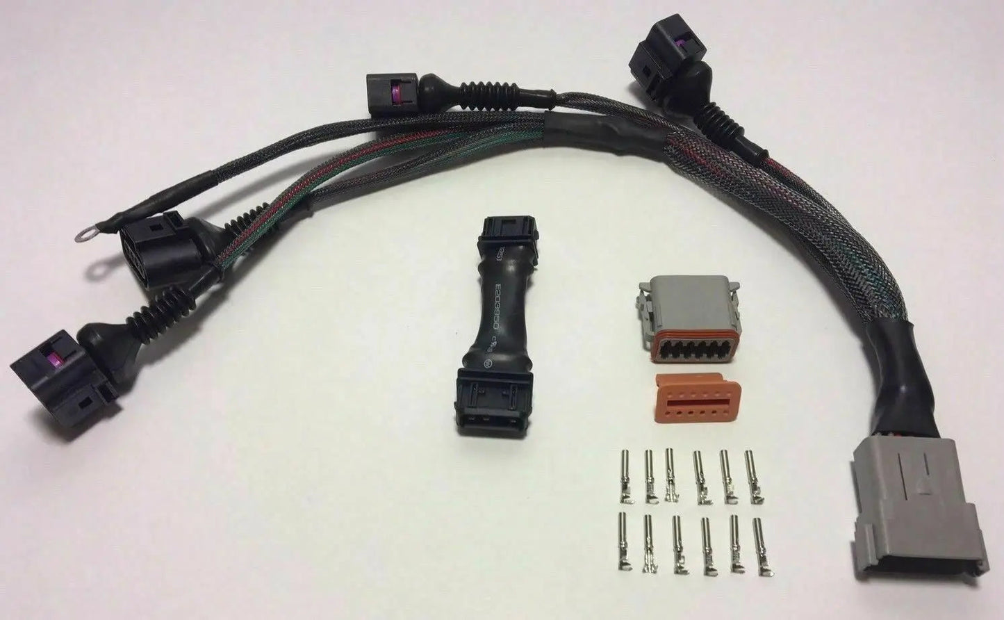 Jack Spania Racing Audi VW 1.8T to 2.0T FSI coil conversion harness with ICM delete plates for GTI engine upgrade.