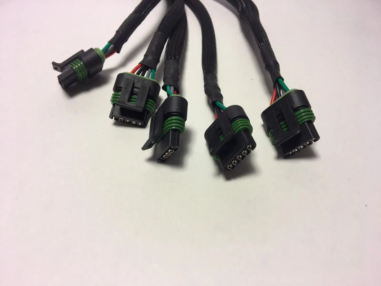 034 Motorsport AAN plug-in wiring harness for VW/Audi 2.0T high output engine, shown installed on engine components.