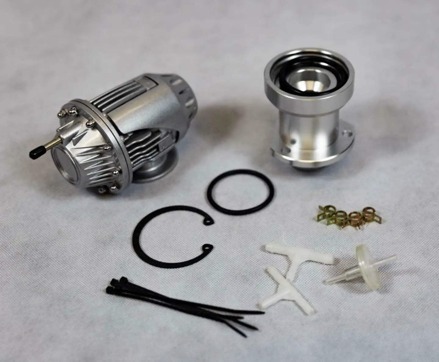 Jack Spania Racing VW Audi Golf GTI MK5 MK6 EA888 2.0T SSQV Blow Off Valve BOV with direct fit adapter installed on engine.
