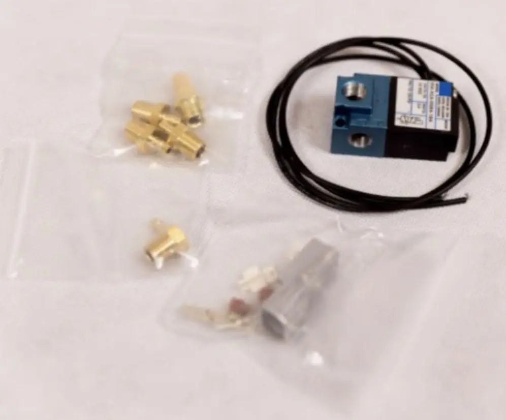 Jack Spania Racing MAC 3-Port Electronic Boost Control Solenoid Valve fitting connector for engine parts, showing detailed metal components.