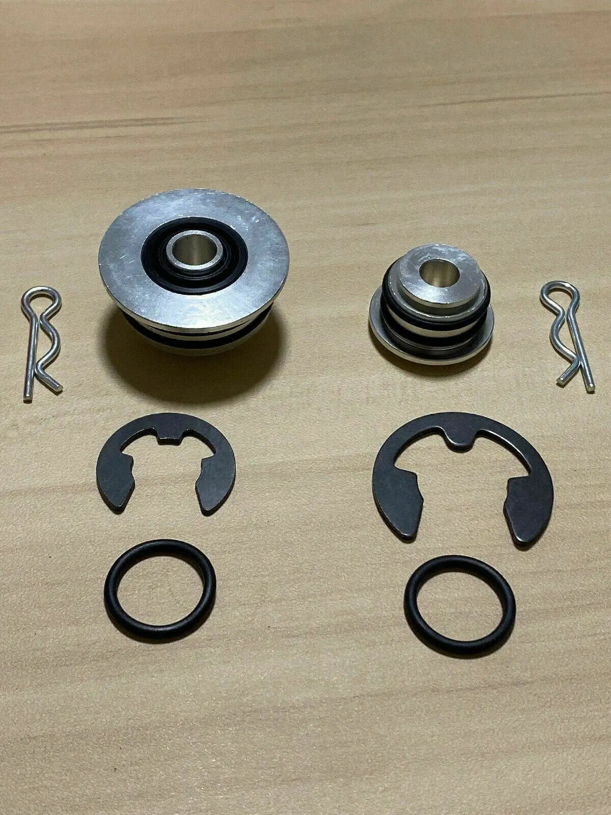 Jack Spania Racing billet spherical shifter cable bushings for OEM K20 K24 DC2 EK CRX Si transmission cables, shown installed.