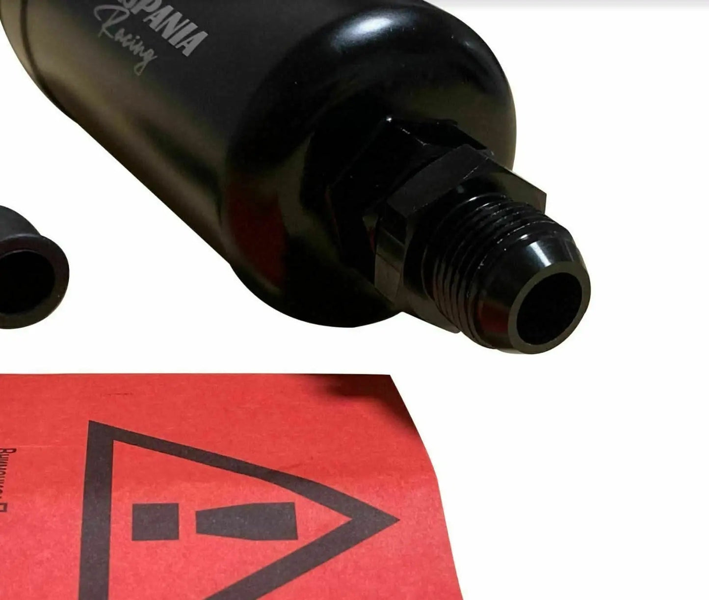 Jack Spania Racing billet aluminum external fuel pump surge tank for AEM Bosch 044 380LPH E85 engine setup, with fittings and mounting points.
