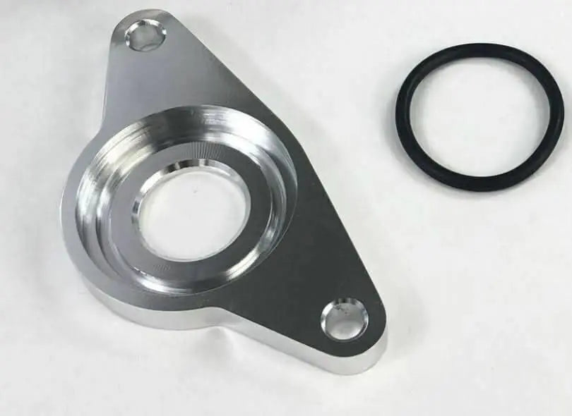 Subaru flange for HKS SSQV blow off valve on Impreza WRX and STi, Jack Spania Racing engine part with metal connector and mounting surface.