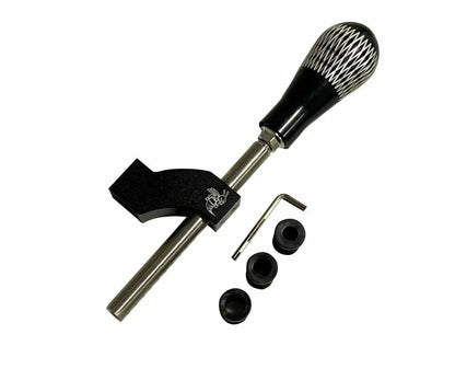 Interior shot of a Jack Spania Racing adjustable shifter extender with shift knob installed in a car's gear shifter area.